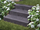 Blocs marches en basalte Takeda avec fleurs et gazon